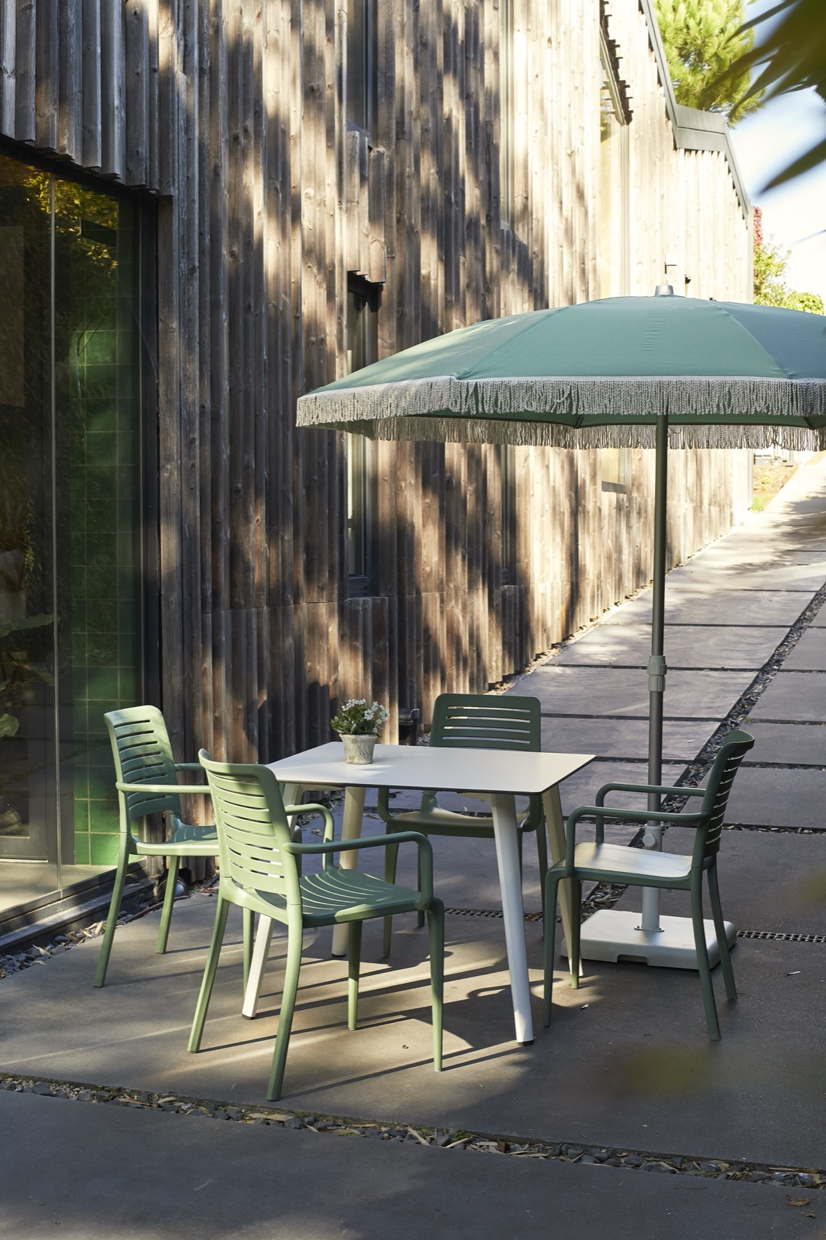 Ezpeleta parasol shading an outdoor dining terrace