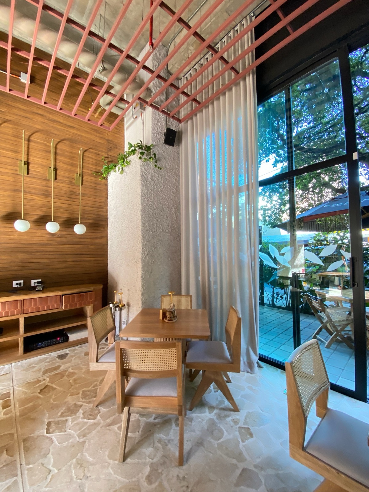 Restaurant dining room framed by sheer drapes
