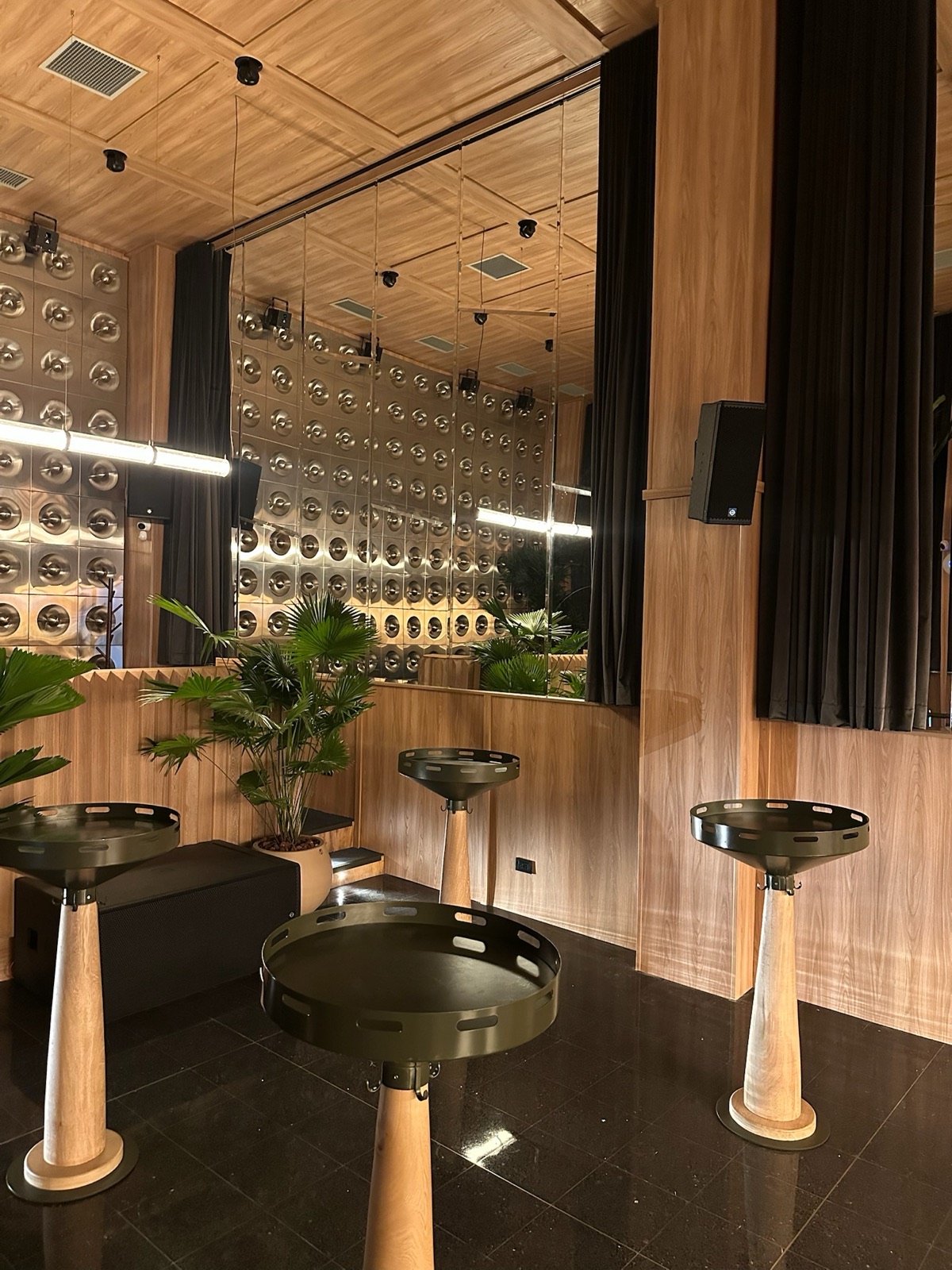 Cocktail bar with floor-to-ceiling blackout drapes
